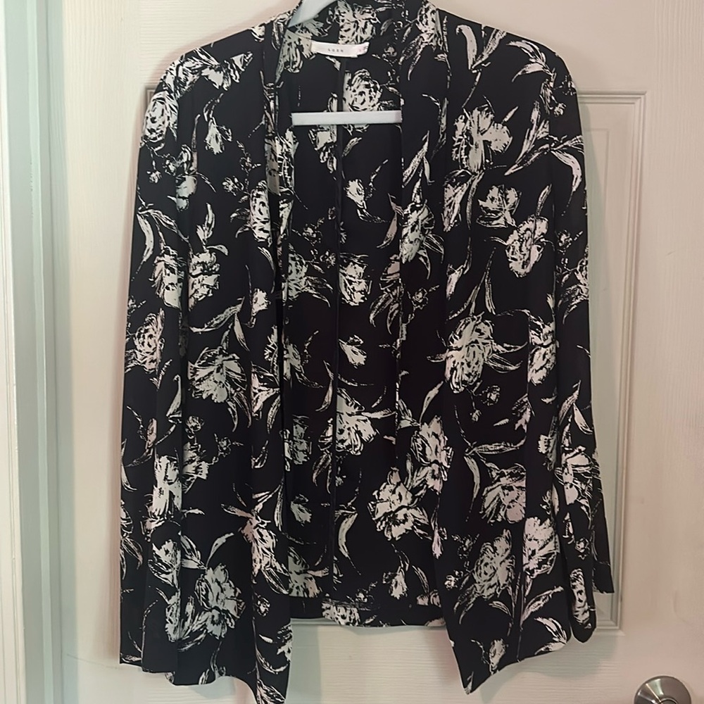 Lush open blazer 100% polyester.  Size Large.‎ Navy with cream floral prints.